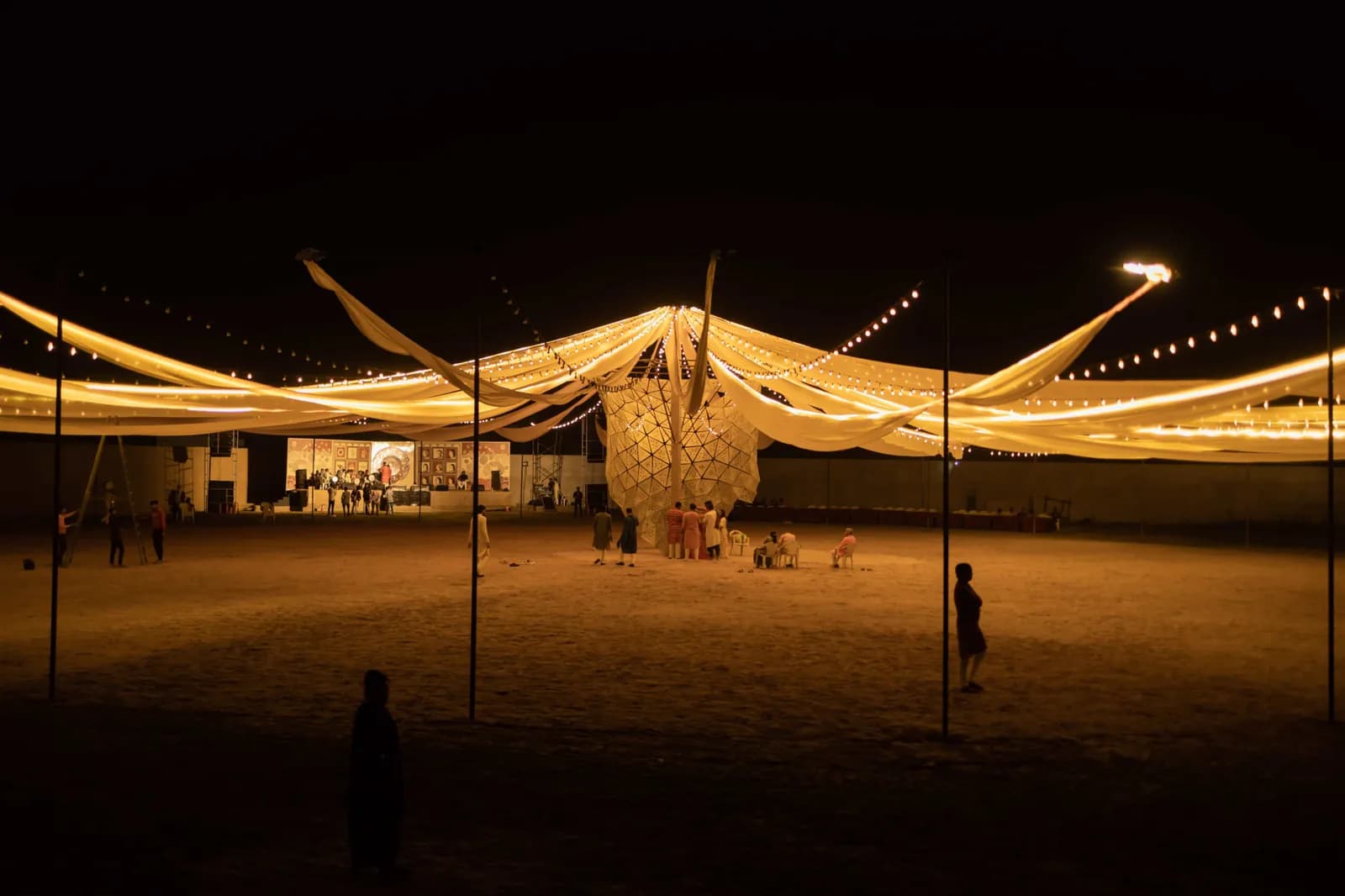 The fabric canopy lit from beneath, spanning the ground