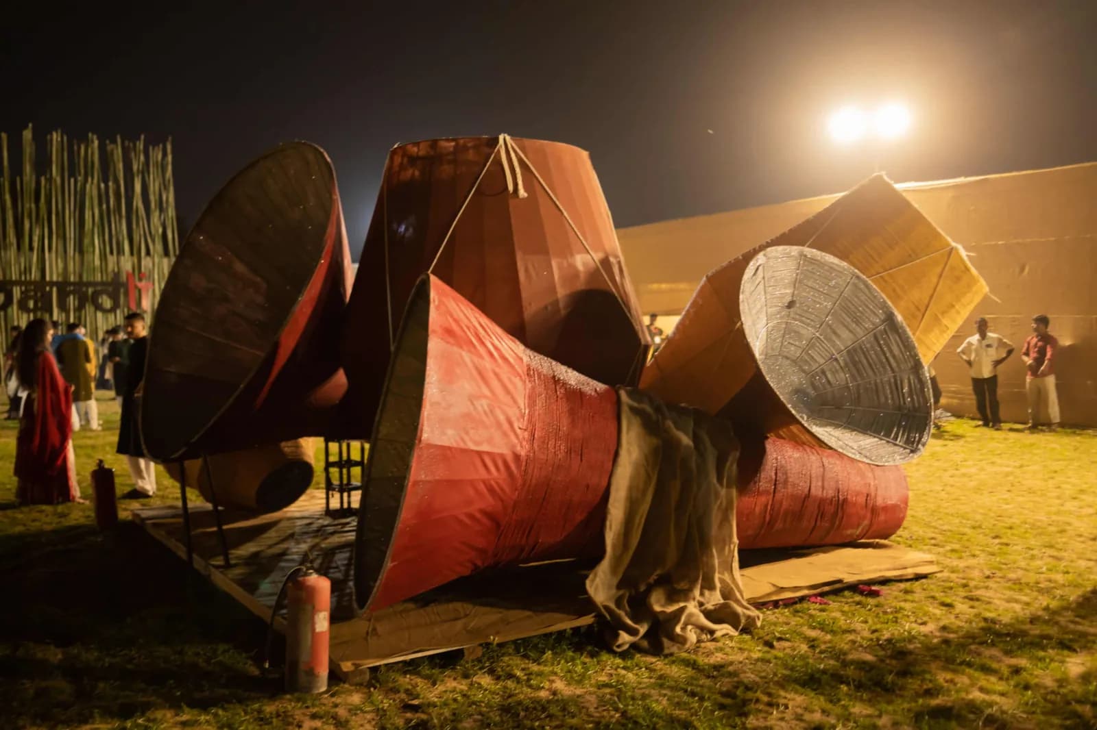 Large decorated dhol drums standing on the grass